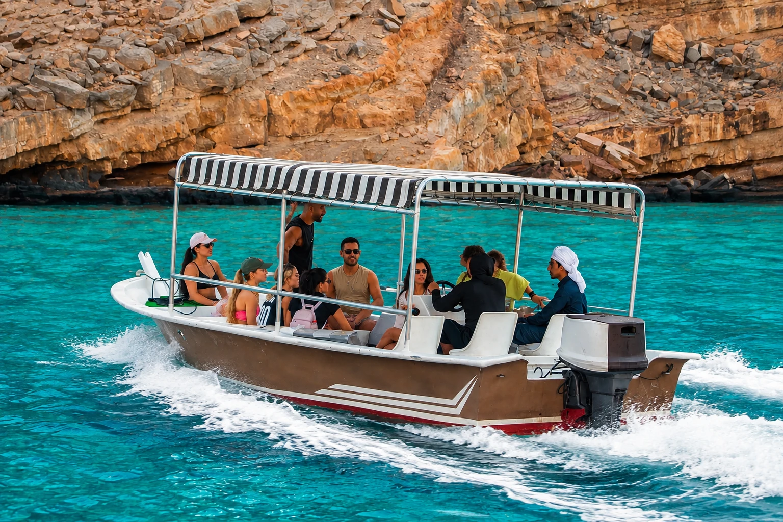 Speed boat cruising through the scenic waters of Musandam Oman