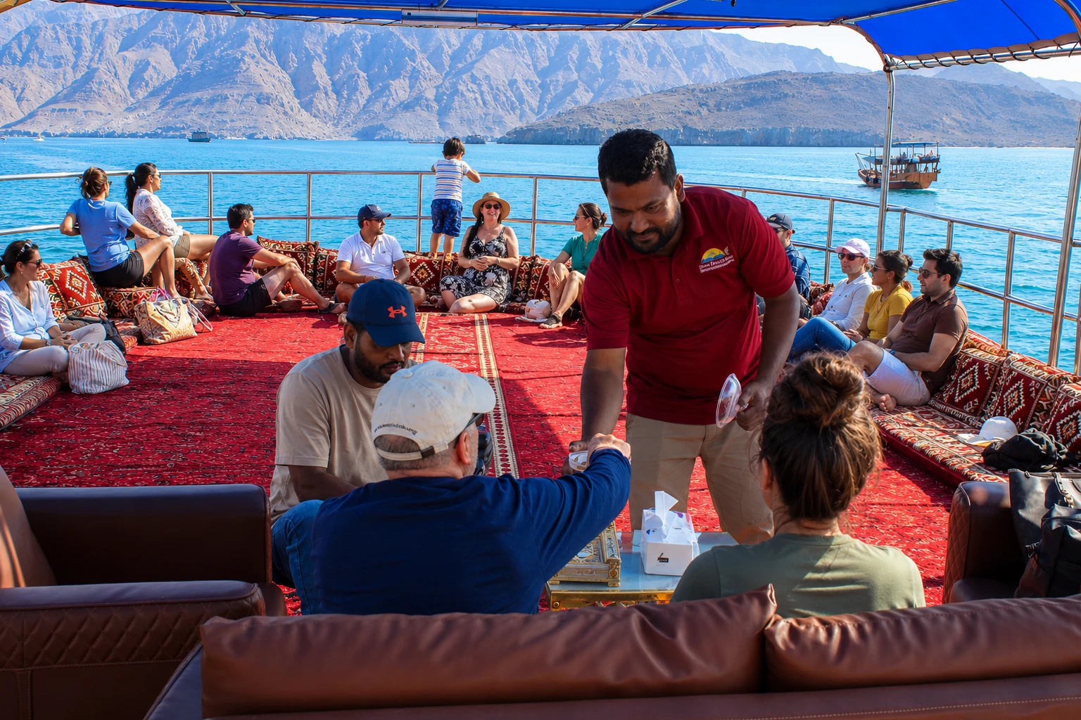 Travelers enjoying a scenic dhow cruise along the Musandam coastline