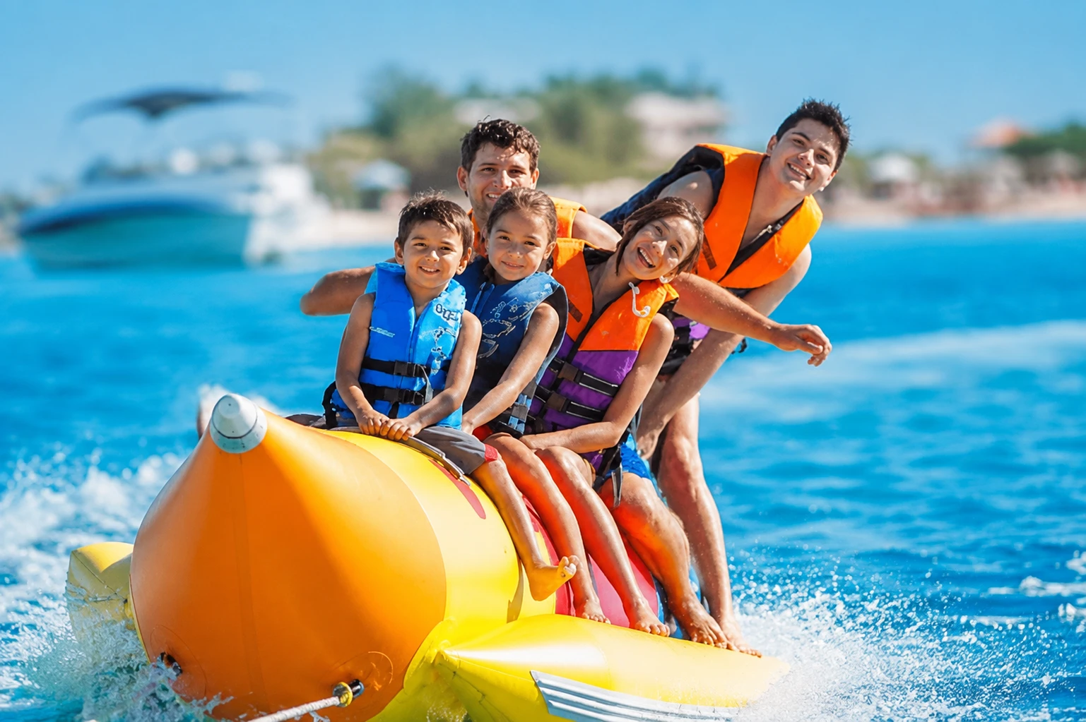 Tourists enjoying a banana boat ride during the Musandam Dibba cruise