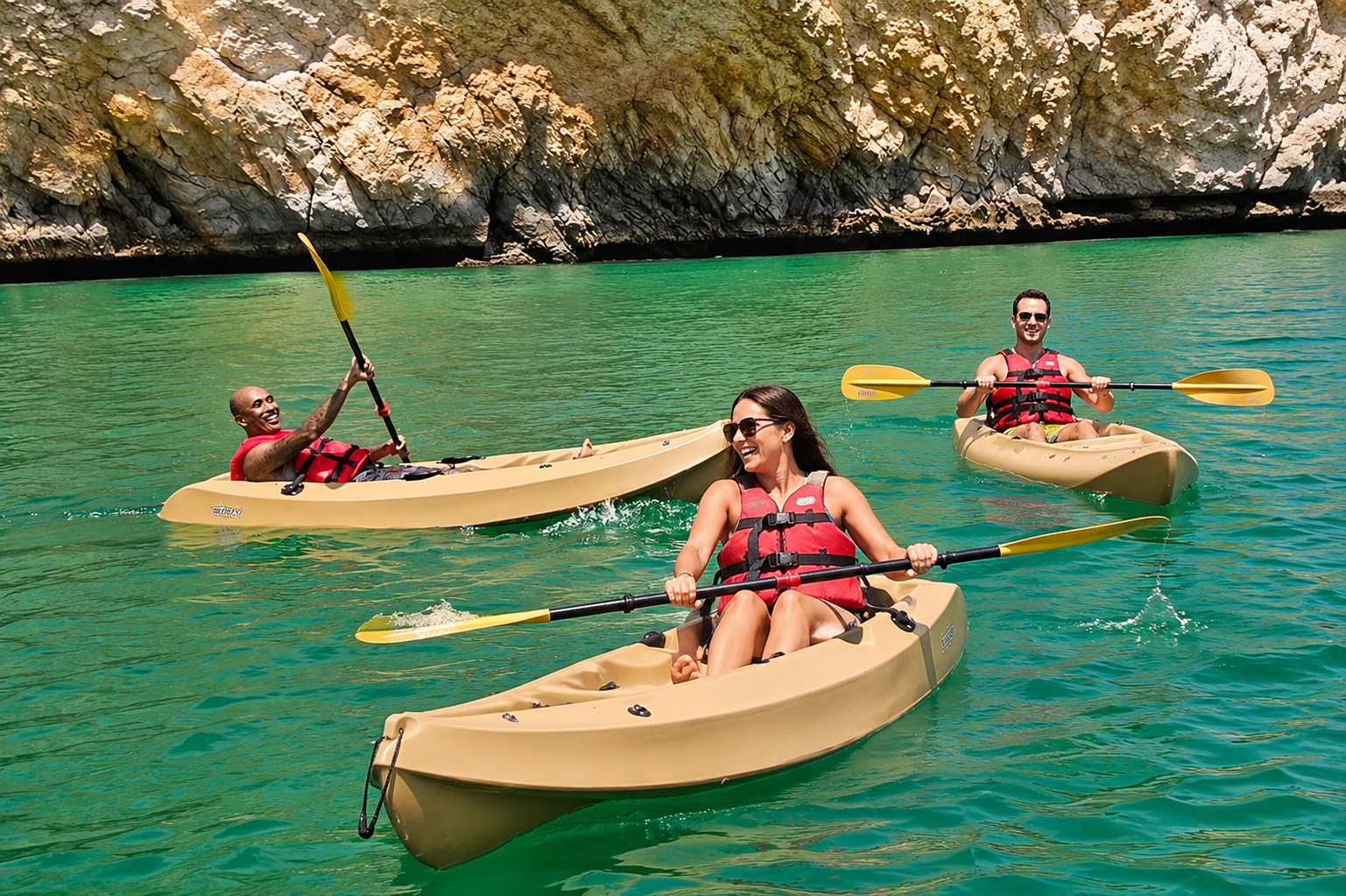 Tourists kayaking in the clear waters during a Musandam Dibba cruise